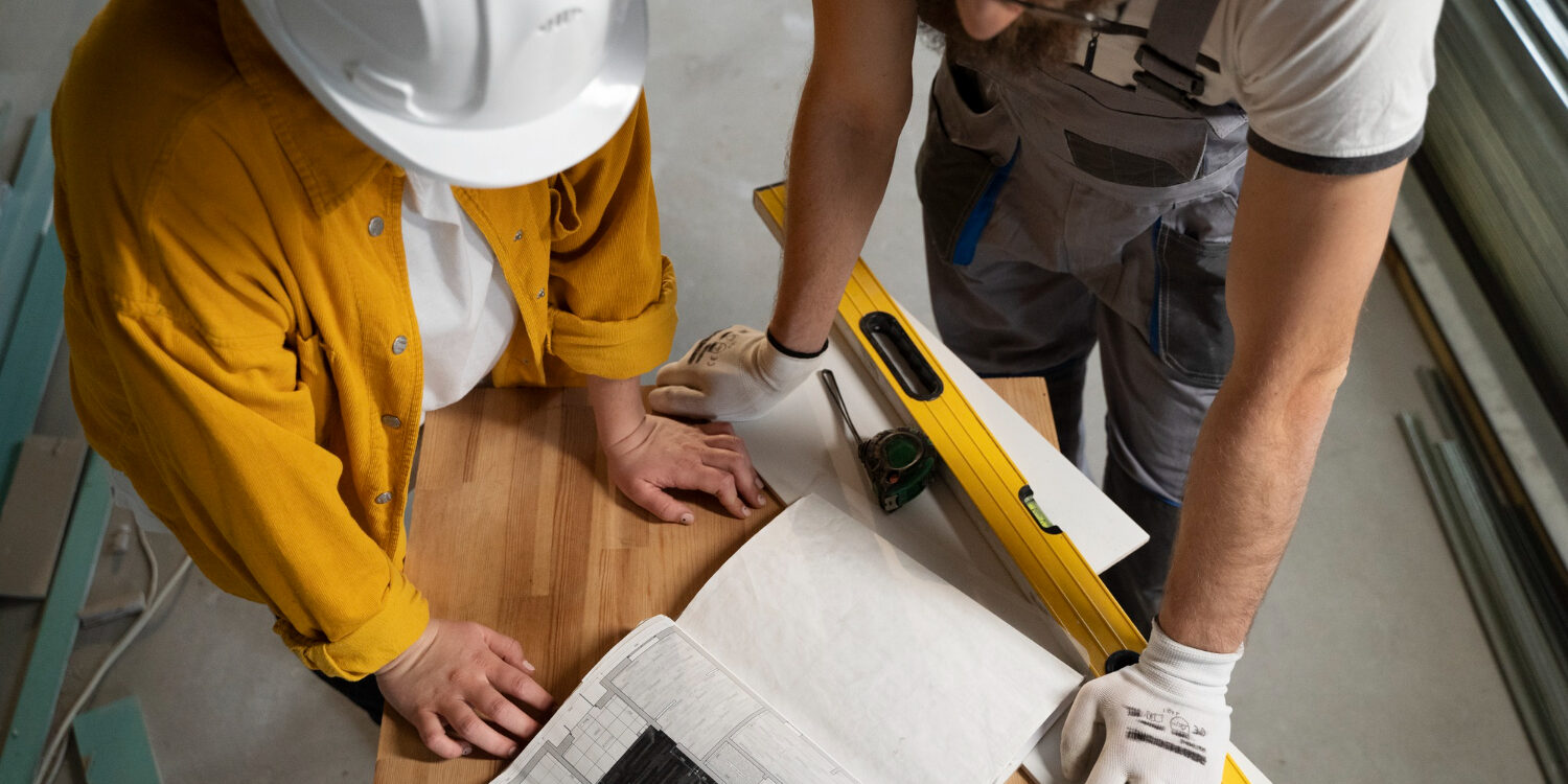 tiler-working-renovation-apartment Contractor working on a home remodel vs DIY project