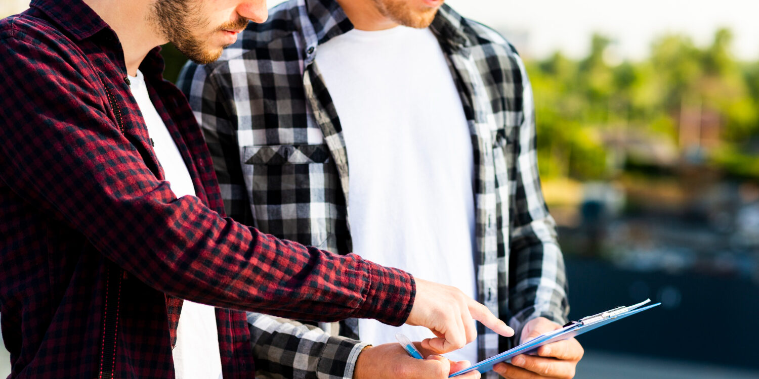 2148233774 Homeowner discussing renovation plans with a remodeling contractor in Bellville TX