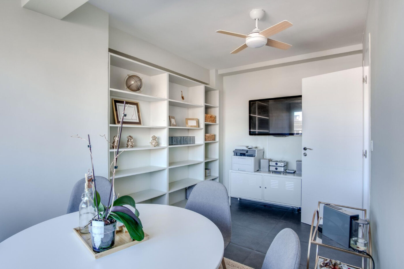 Modern open-concept small living space remodeled with smart storage solution