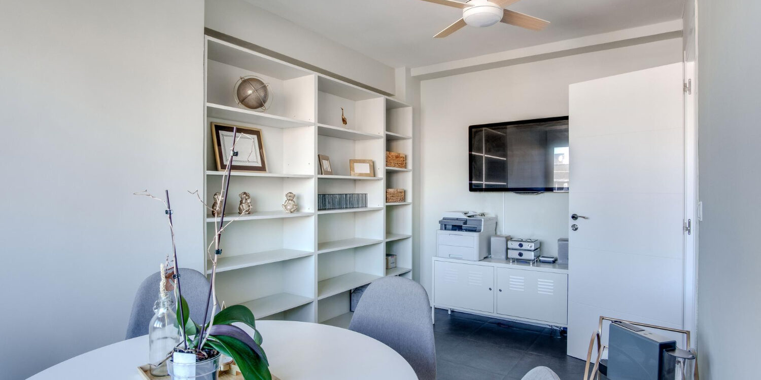 4337 Modern open-concept small living space remodeled with smart storage solution