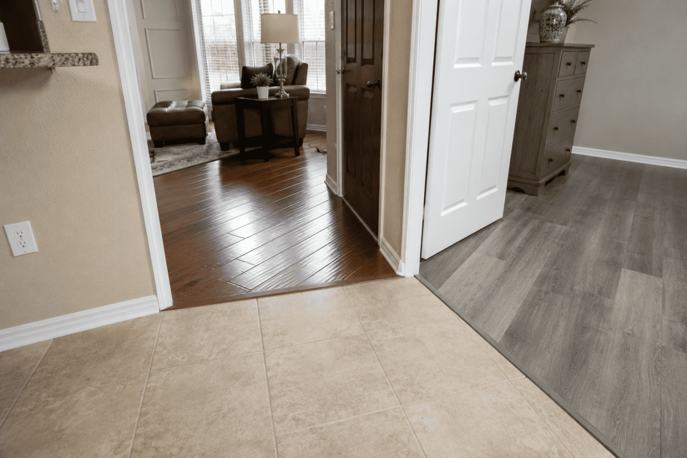 image-modern-home-hallway-with-varied-flooring Texas flooring options including tile vinyl and hardwood inside a home